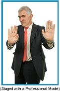 Older man in suit with both hands extended palms up as if saying "No Comment". (Staged with Professional Model).